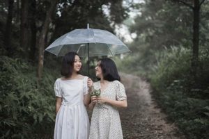 Two girls walking along a path