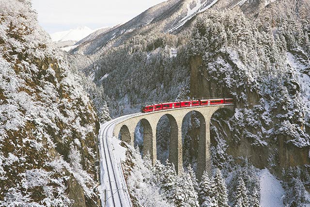 Train passing through a mountain tunnel