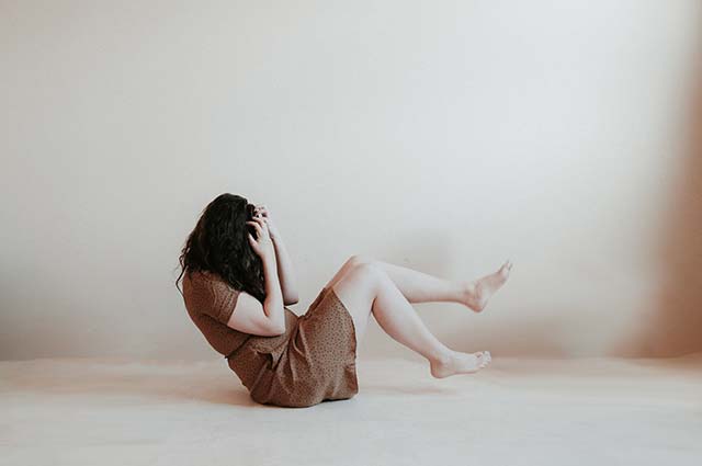 A woman sitting on the floor