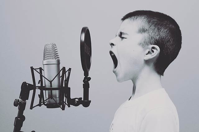 Child yelling at microphone