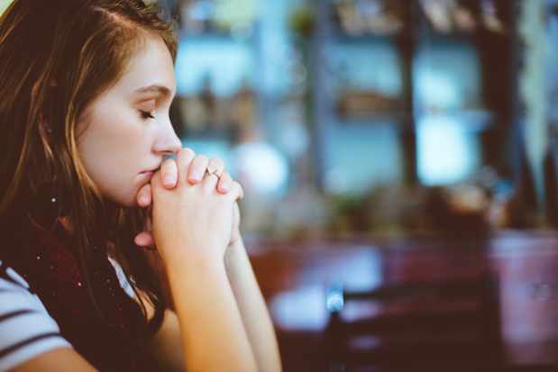 Young woman praying