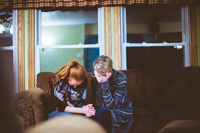 Two women praying