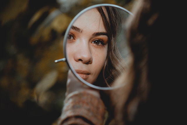 Woman looking in mirror