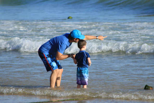 Woman with son on beach